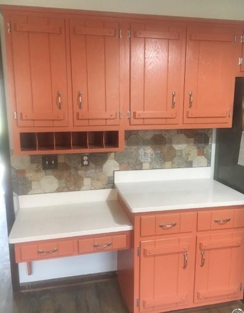 Kitchen remodel with custom painted cabinetry and decorative tile backsplash